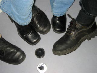 Photo: Different shoes surrounding a box of shoe polish