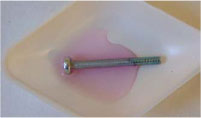 Spot test of the same type of screw with diluted test solution.